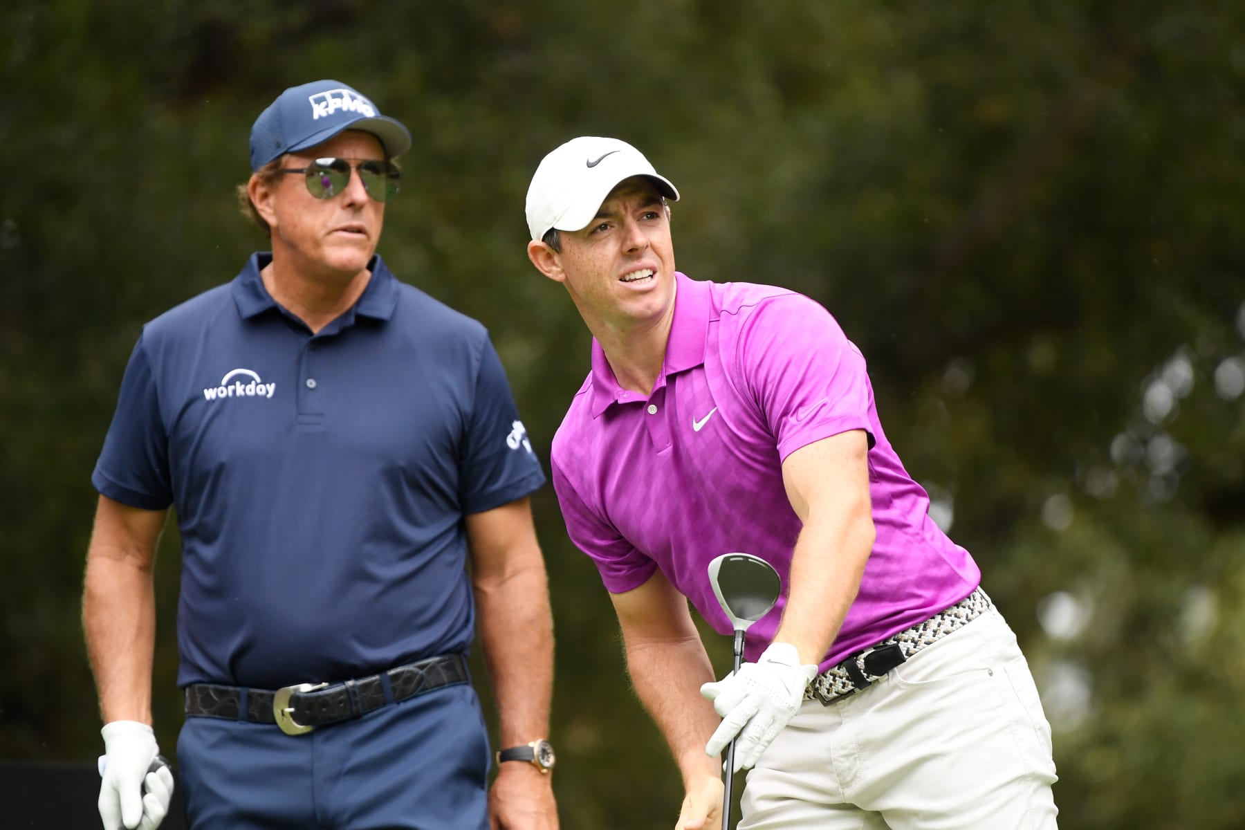 THOUSAND OAKS, CALIFORNIA - OCTOBER 22: Rory McIlroy of Northern Ireland watches his shot from the sixth tee as Phil Mickelson of the United States looks on during the first round of the Zozo Championship @ Sherwood on October 22, 2020 in Thousand Oaks, California. (Photo by Harry How/Getty Images)