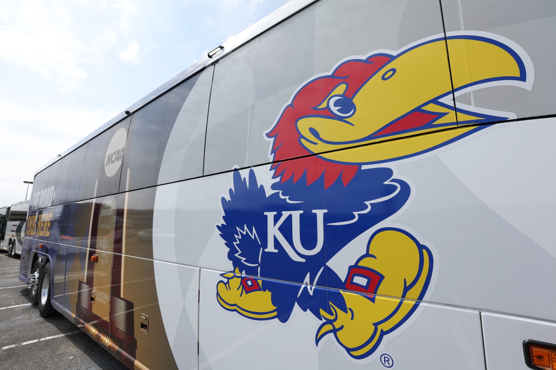 NEW ORLEANS, LA - MARCH 30: A bus decorated with the Kansas Jayhawks and Final Four logos sits at the Louis Armstrong New Orleans International Airport on March 30, 2022 in New Orleans, Louisiana. (Photo by Isaiah Vazquez/NCAA Photos via Getty Images)