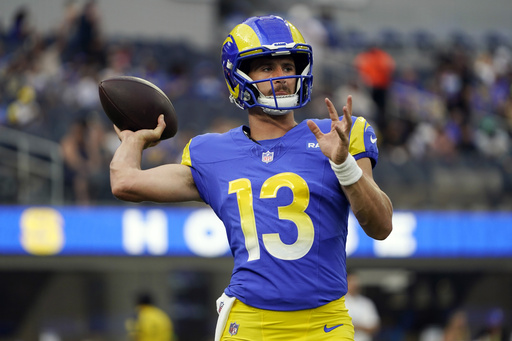 Los Angeles Rams quarterback Stetson Bennett (13) passes the ball during an  NFL preseason game. The Chargers defeated the Rams 34-17 on Saturday, Aug  12, 2023 in Inglewood, Calif. (Ed Ruvalcaba/Image of