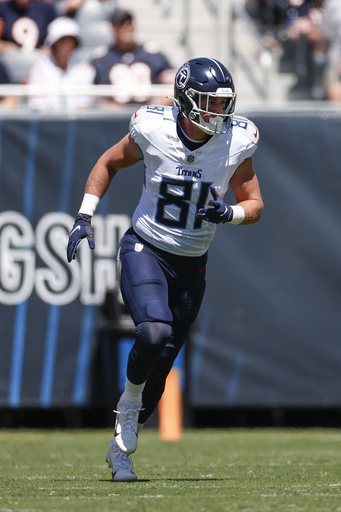 Chicago Bears offensive tackle Aviante Collins (74) blocks against the Tennessee  Titans during the first half of an NFL preseason football game, Saturday,  Aug. 12, 2023, in Chicago. (AP Photo/Kamil Krzaczynski Stock