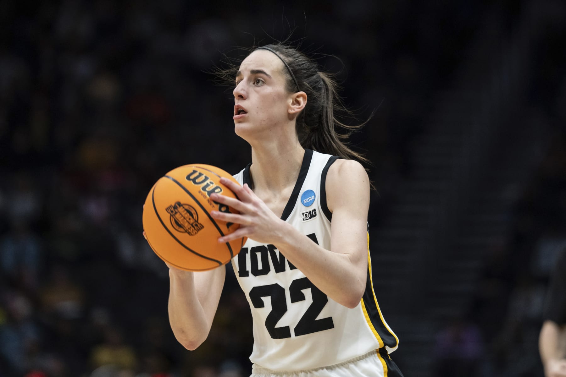 Iowa guard Caitlin Clark shoots the ball against Louisville during an Elite 8 college basketball game of the NCAA Tournament, Sunday, March 26, 2023, in Seattle. Iowa won 97-83. (AP Photo/Stephen Brashear)