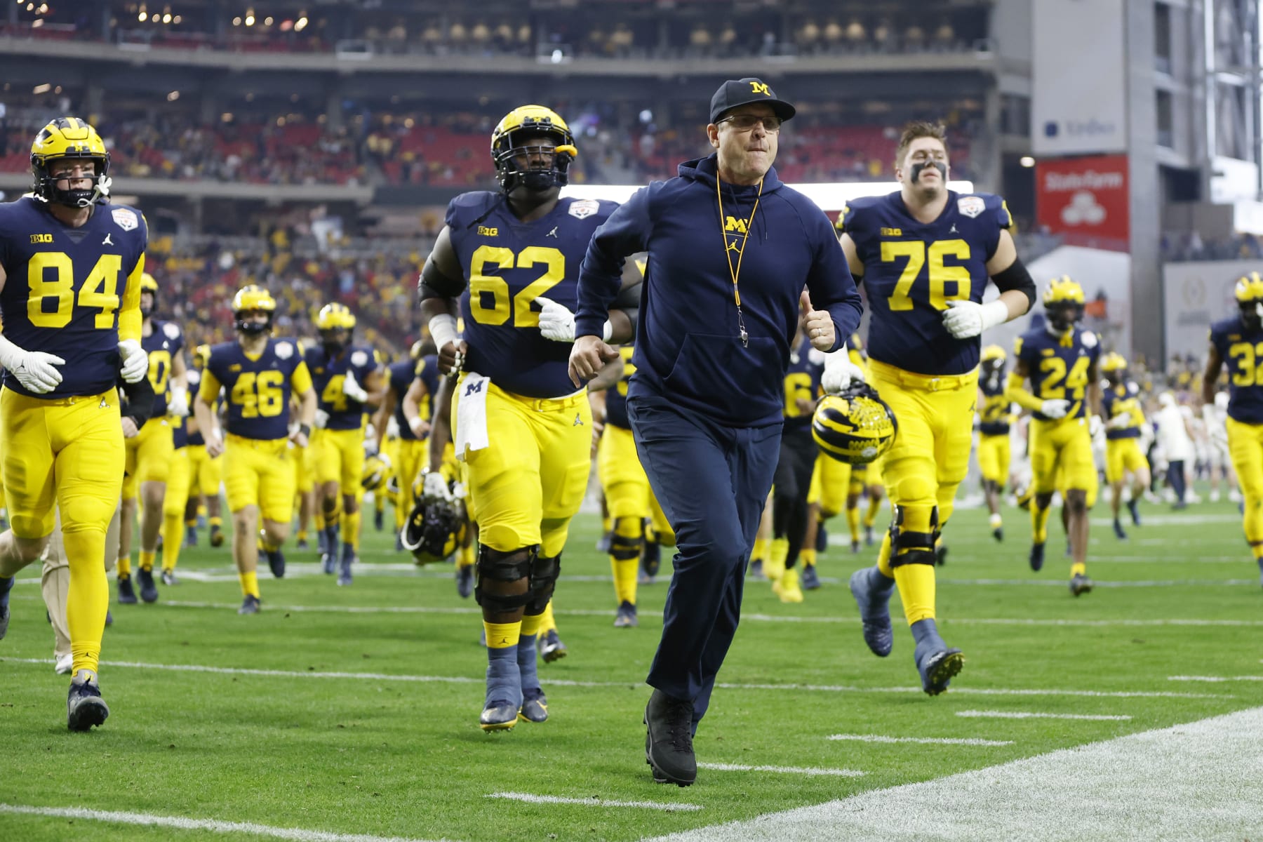 GLENDALE, ARIZONA - DECEMBER 31: The Michigan Wolverines return to the locker room after warmups prior to the game against the TCU Horned Frogs in the Vrbo Fiesta Bowl at State Farm Stadium on December 31, 2022 in Glendale, Arizona. (Photo by Chris Coduto/Getty Images) GLENDALE, ARIZONA - DECEMBER 31: The Michigan Wolverines return to the locker room after warmups prior to the game against the TCU Horned Frogs in the Vrbo Fiesta Bowl at State Farm Stadium on December 31, 2022 in Glendale, Arizona. (Photo by Chris Coduto/Getty Images)