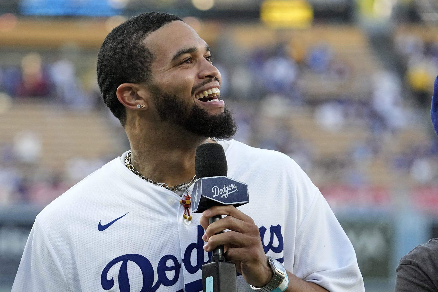 Southern California quarterback Caleb Williams reacts to fans prior to a baseball game between the Los Angeles Dodgers and the Los Angeles Angels Friday, July 7, 2023, in Los Angeles. (AP Photo/Mark J. Terrill)