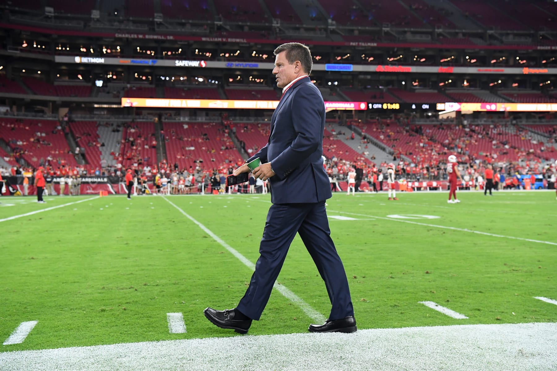 GLENDALE, ARIZONA - AUGUST 19: Arizona Cardinals owner Michael Bidwill walks along the sidelines prior to a preseason game against the Kansas City Chiefs at State Farm Stadium on August 19, 2023 in Glendale, Arizona. (Photo by Norm Hall/Getty Images)