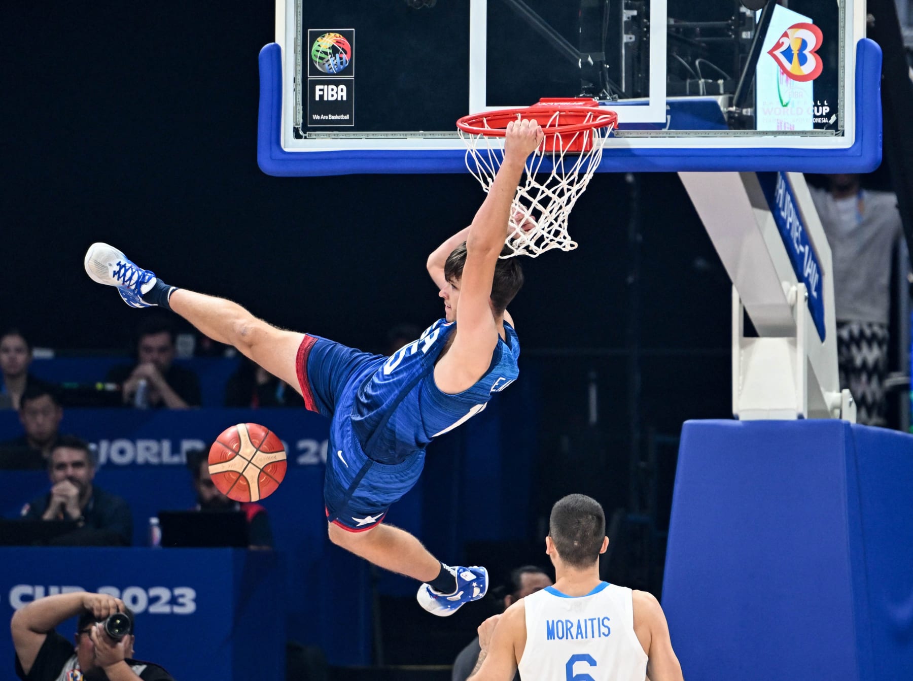US' Austin Reaves (L) hangs onto the basket during the FIBA Basketball World Cup group C match between US and Greece at the Mall of Asia Arena in Pasay city, suburban Manila on August 28, 2023. (Photo by SHERWIN VARDELEON / AFP) (Photo by SHERWIN VARDELEON/AFP via Getty Images) US' Austin Reaves (L) hangs onto the basket during the FIBA Basketball World Cup group C match between US and Greece at the Mall of Asia Arena in Pasay city, suburban Manila on August 28, 2023. (Photo by SHERWIN VARDELEON / AFP) (Photo by SHERWIN VARDELEON/AFP via Getty Images)
