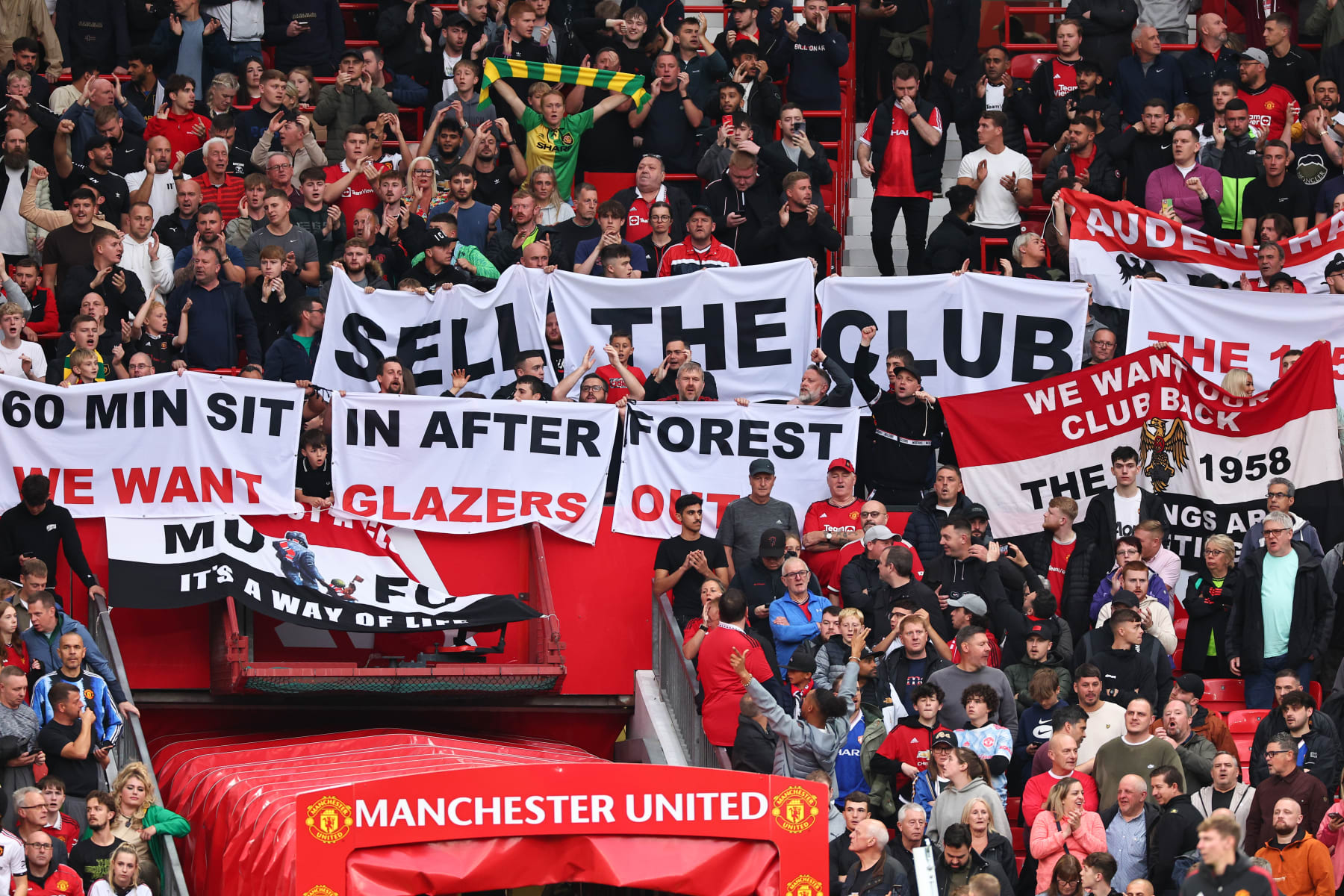 MANCHESTER, ENGLAND - AUGUST 14: Fans of Manchester United protest against the owners, the Glazer family during the Premier League match between Manchester United and Wolverhampton Wanderers at Old Trafford on August 14, 2023 in Manchester, England. (Photo by Robbie Jay Barratt - AMA/Getty Images)
