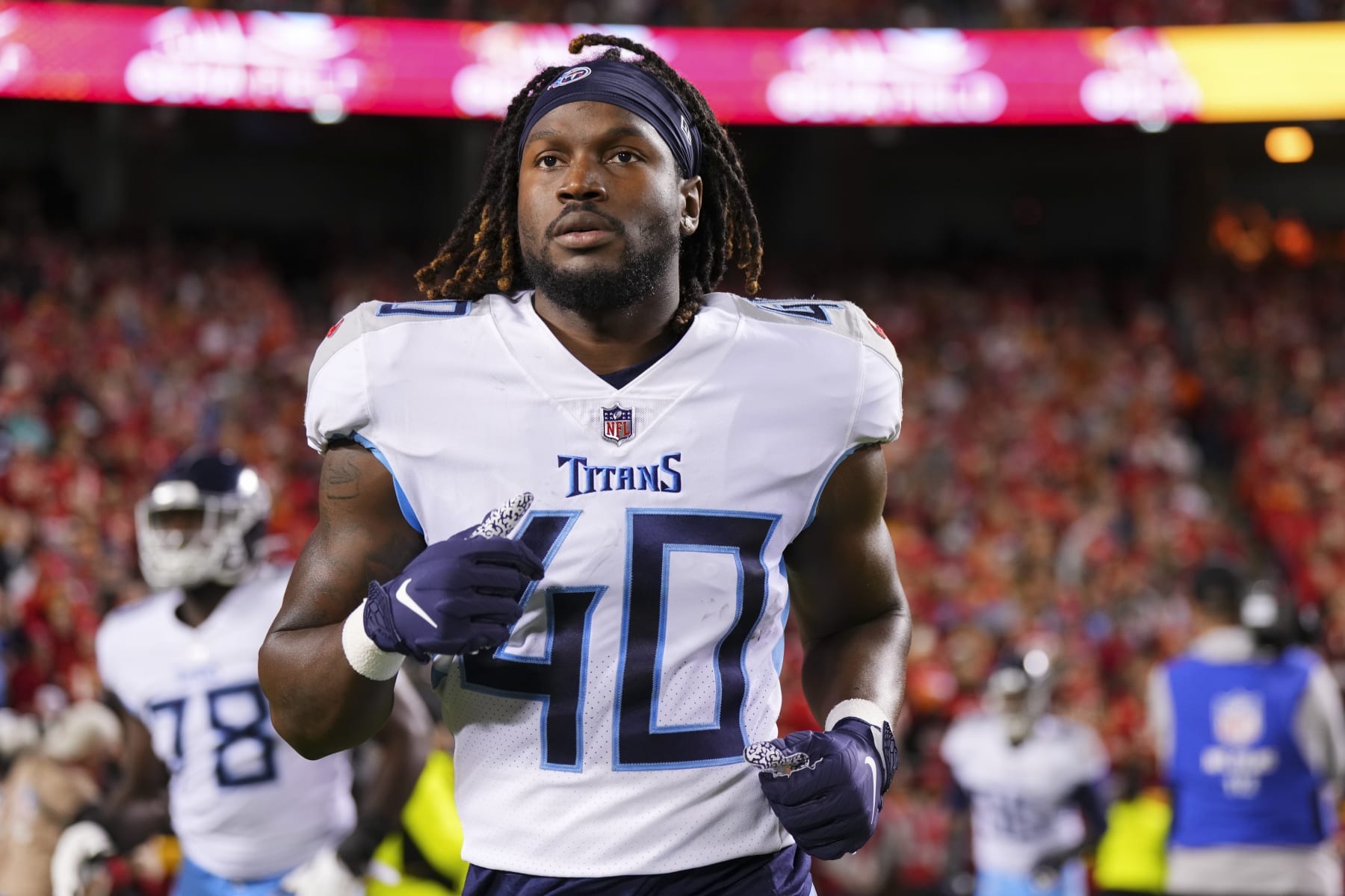 Tarell Basham of the Tennessee Titans defends against the Dallas