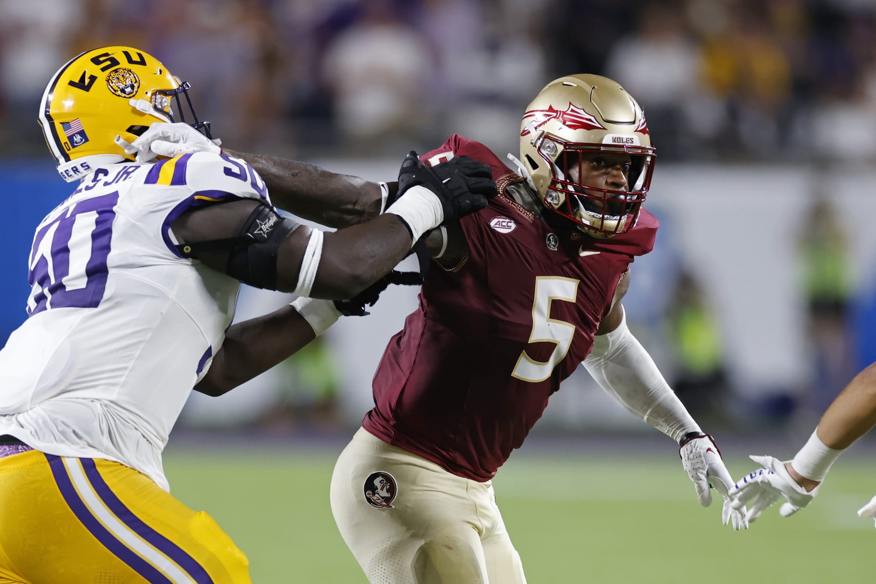 ORLANDO, FL - SEPTEMBER 03: Florida State Seminoles defensive lineman Jared Verse (5) rushes on defense while blocked by LSU Tigers offensive lineman Emery Jones Jr. (50) during a college football game on September 03, 2023 at Camping World Stadium in Orlando, Florida. (Photo by Joe Robbins/Icon Sportswire via Getty Images)