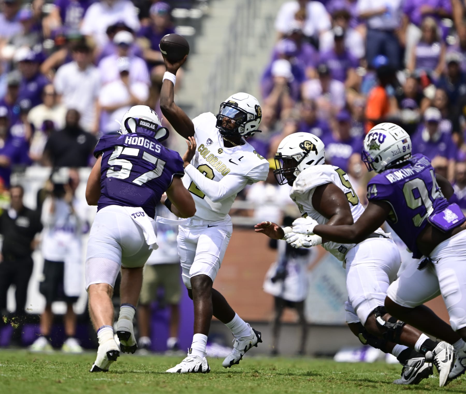 FT. WORTH, TX - SEPTEMBER 02: Colorado Buffaloes quarterback Shedeur Sanders (2) throws under pressure from TCU Horned Frogs linebacker Johnny Hodges (57) in the second quarter at Amon G. Carter Stadium in Ft. Worth September 02, 2023. (Photo by Andy Cross/MediaNews Group/The Denver Post via Getty Images)