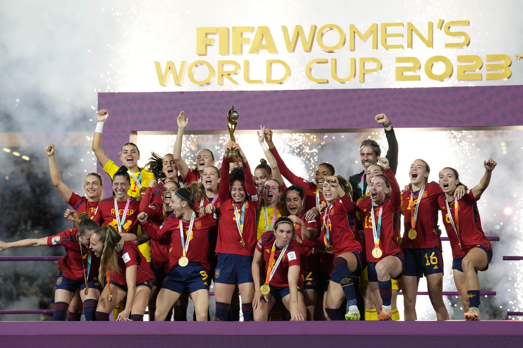 Team Spain celebrates with the trophy after winning the Women's World Cup soccer final against England at Stadium Australia in Sydney, Australia, Sunday, Aug. 20, 2023. (AP Photo/Alessandra Tarantino)