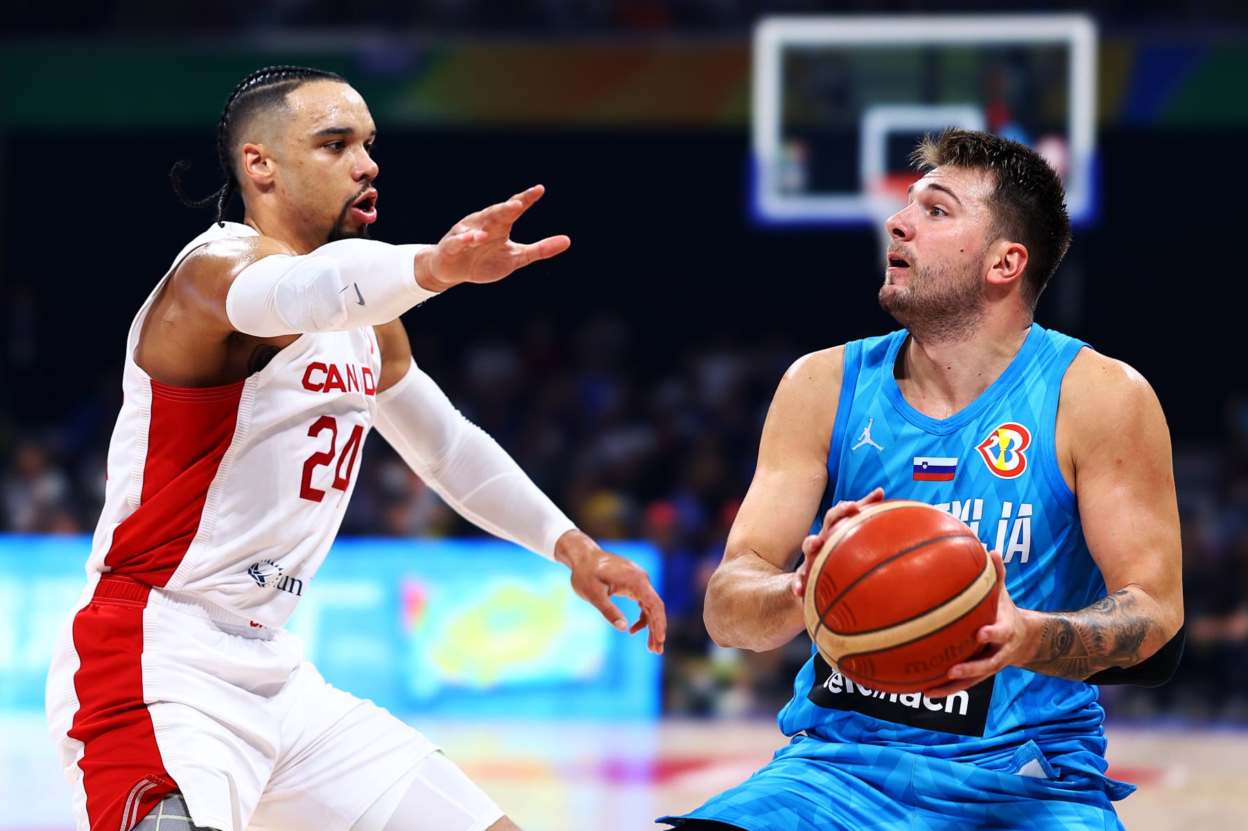 MANILA, PHILIPPINES - SEPTEMBER 06: Luka Doncic #77 of Slovenia drives against Dillon Brooks #24 of Canada in the first quarter during the FIBA Basketball World Cup quarterfinal game at Mall of Asia Arena on September 06, 2023 in Manila, Philippines. (Photo by Yong Teck Lim/Getty Images)