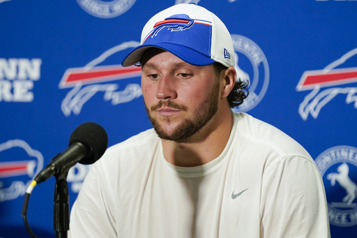 Buffalo Bills quarterback Josh Allen warms up in a signed Ryan Fitzpatrick  Bills jersey