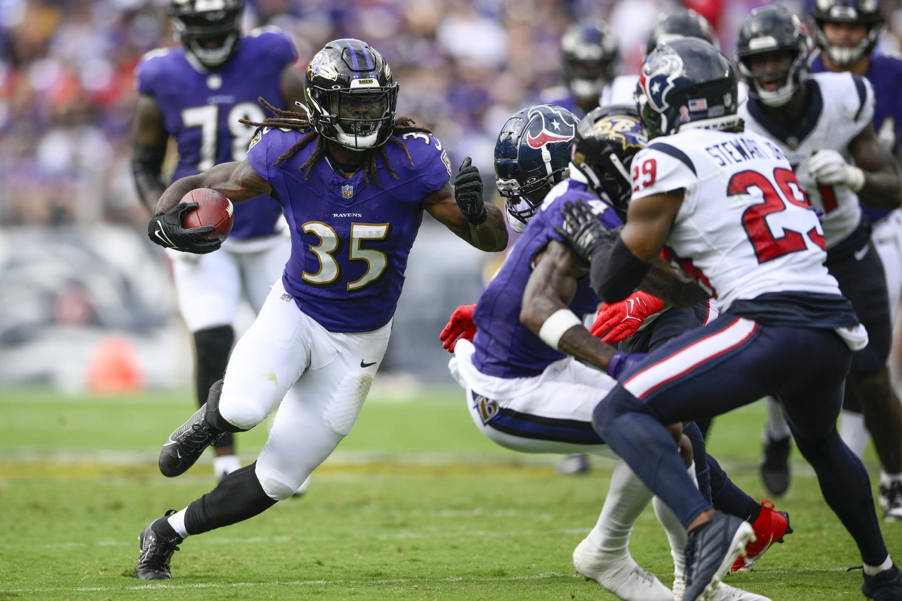 BALTIMORE, MD - AUGUST 27: Washington Commanders offensive tackle Saahdiq  Charles (77) exits the field after the NFL preseason football game between  the Washington Commanders and Baltimore Ravens on August 27, 2022