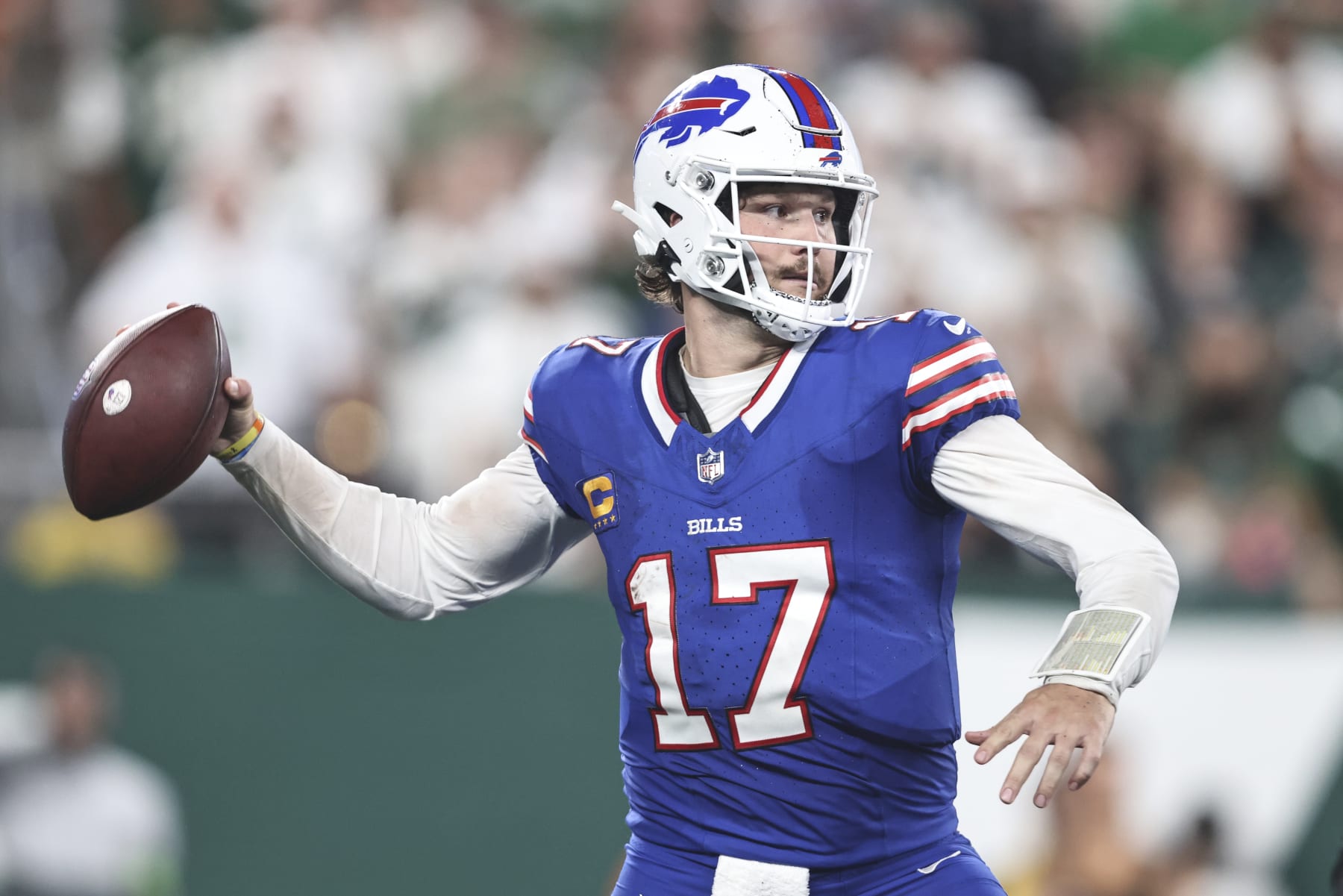 EAST RUTHERFORD, NEW JERSEY - SEPTEMBER 11: Josh Allen #17 of the Buffalo Bills passes against the New York Jets during overtime at MetLife Stadium on September 11, 2023 in East Rutherford, New Jersey. (Photo by Michael Owens/Getty Images)
