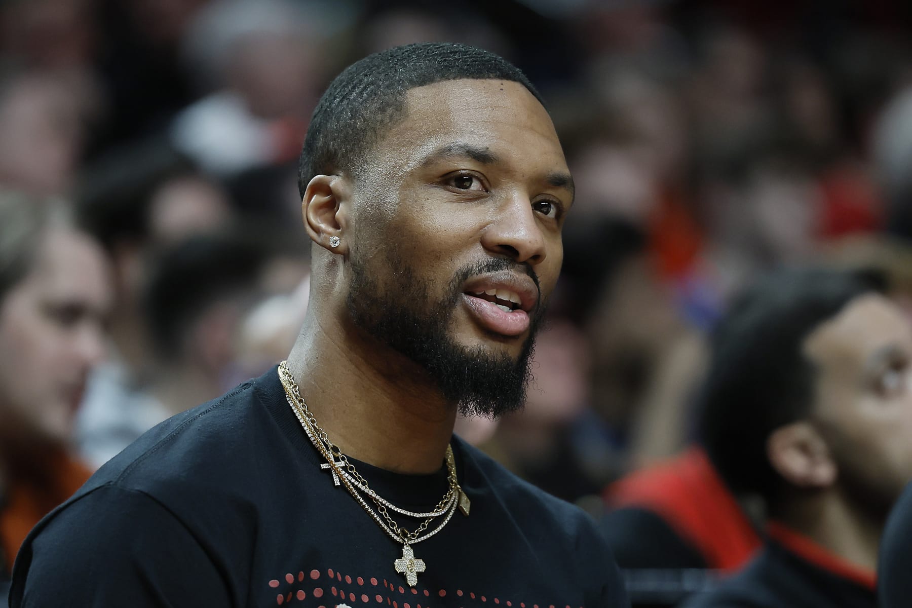 PORTLAND, OREGON - MARCH 24: Damian Lillard #0 of the Portland Trail Blazers watches from the bench during the second half against the Chicago Bulls at Moda Center on March 24, 2023 in Portland, Oregon. NOTE TO USER: User expressly acknowledges and agrees that, by downloading and or using this photograph, User is consenting to the terms and conditions of the Getty Images License Agreement. (Photo by Soobum Im/Getty Images)