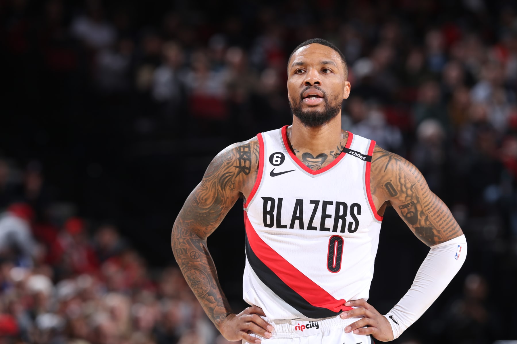 PORTLAND, OR - MARCH 19:  Damian Lillard #0 of the Portland Trail Blazers looks on during the game on March 19, 2023 at the Moda Center Arena in Portland, Oregon. NOTE TO USER: User expressly acknowledges and agrees that, by downloading and or using this photograph, user is consenting to the terms and conditions of the Getty Images License Agreement. Mandatory Copyright Notice: Copyright 2023 NBAE (Photo by Sam Forencich/NBAE via Getty Images)
