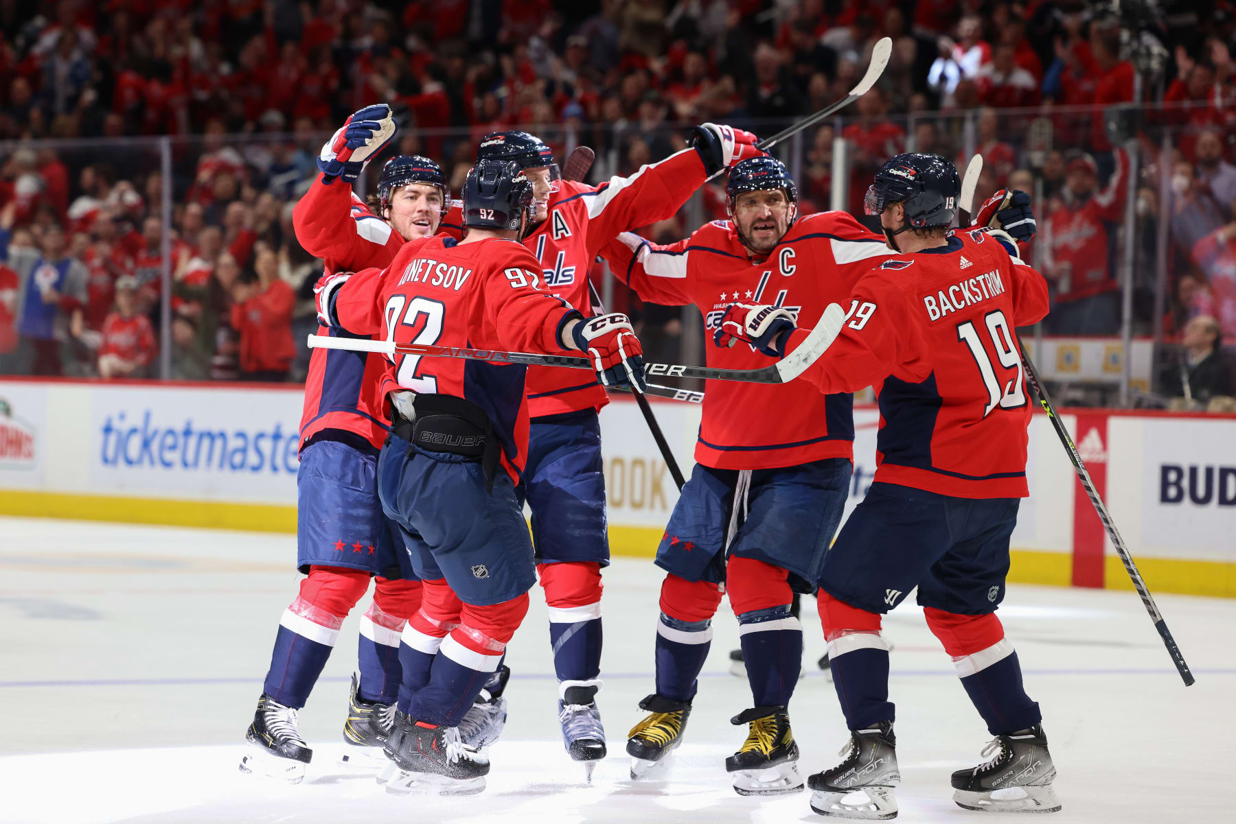 WASHINGTON, DC - APRIL 6: John Carlson #74 of the Washington Capitals celebrates a goal with his team during a game against the Tampa Bay Lightning at Capital One Arena on April 6, 2022 in Washington, D.C. (Photo by John McCreary/NHLI via Getty Images)
