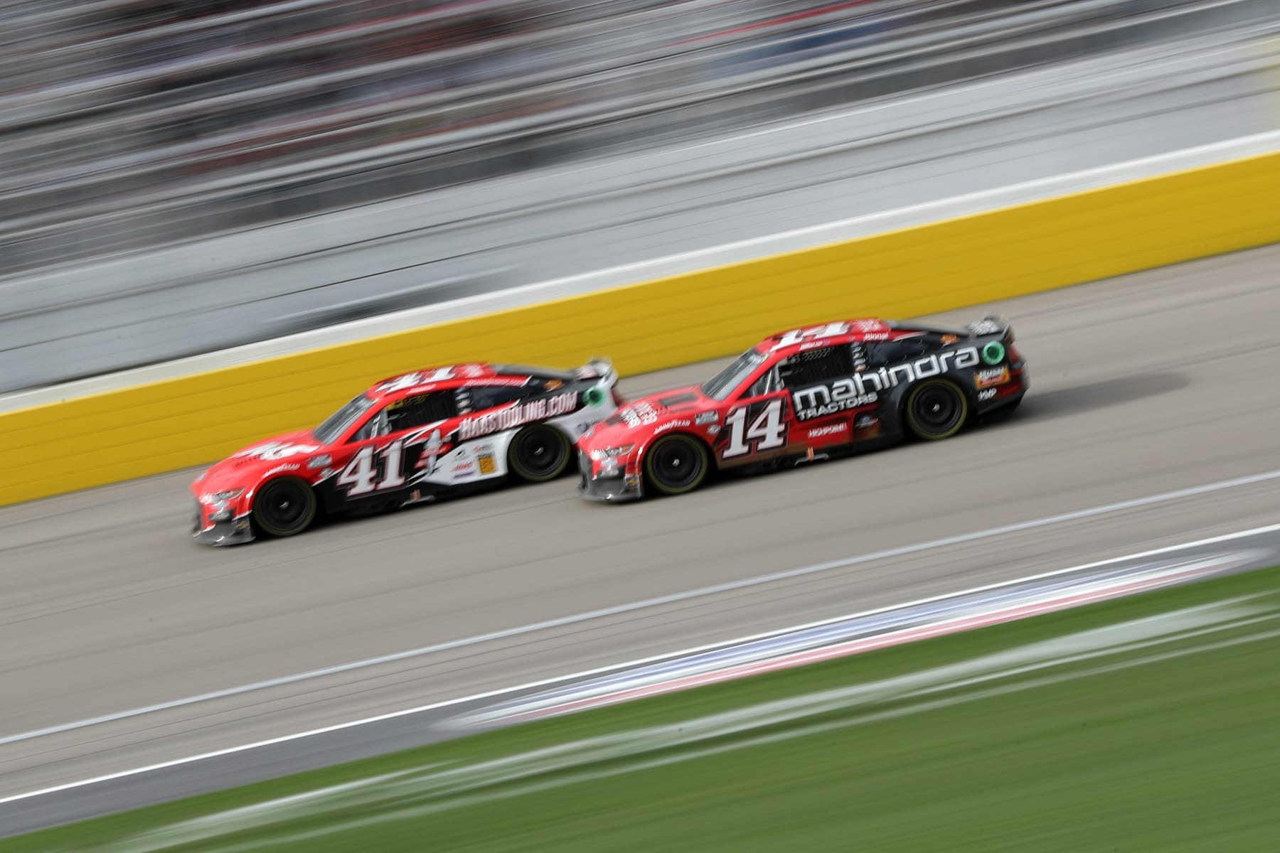 LAS VEGAS, NEVADA - MARCH 05: Ryan Preece, driver of the #41 HaasTooling.com Ford, and Chase Briscoe, driver of the #14 Mahindra Tractors Ford, race during the NASCAR Cup Series Pennzoil 400 at Las Vegas Motor Speedway on March 05, 2023 in Las Vegas, Nevada. (Photo by Meg Oliphant/Getty Images)