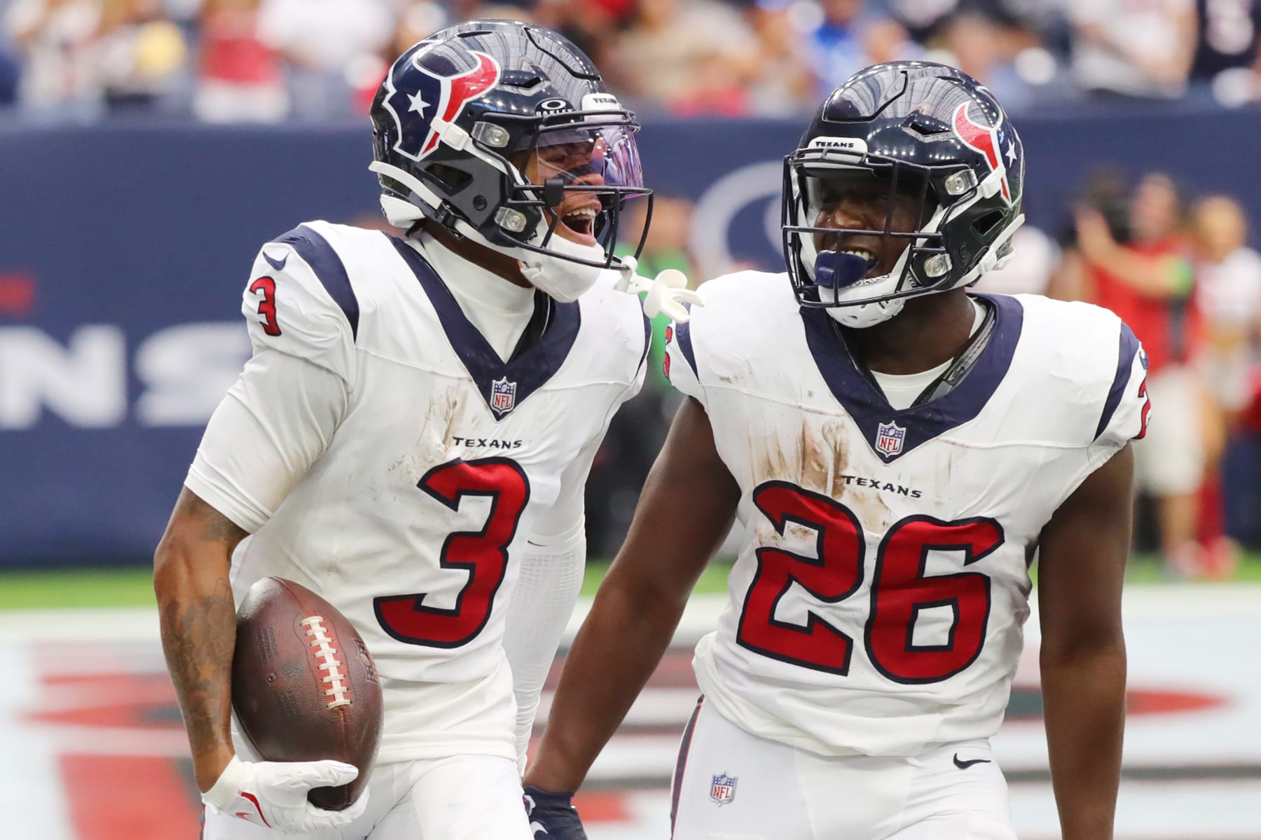 HOUSTON, TEXAS - SEPTEMBER 17: Tank Dell #3 of the Houston Texans celebrates a receiving touchdown with Devin Singletary #26 during the fourth quarter against the Indianapolis Colts at NRG Stadium on September 17, 2023 in Houston, Texas. (Photo by Bob Levey/Getty Images)