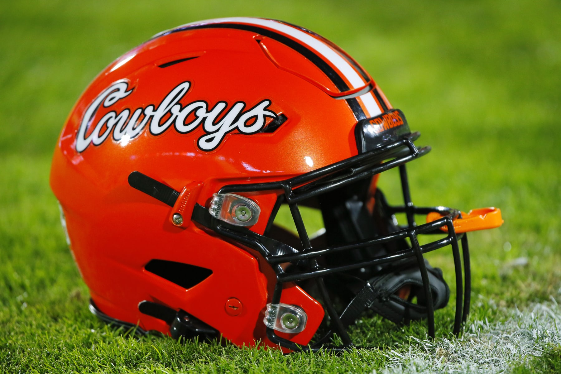 NORMAN, OK - NOVEMBER 19:  An Oklahoma State Cowboys helmet sits on the sideline before Bedlam against the Oklahoma Sooners at Gaylord Family Oklahoma Memorial Stadium on November 19, 2022 in Norman, Oklahoma.  The Sooners won 28-13.  (Photo by Brian Bahr/Getty Images)
