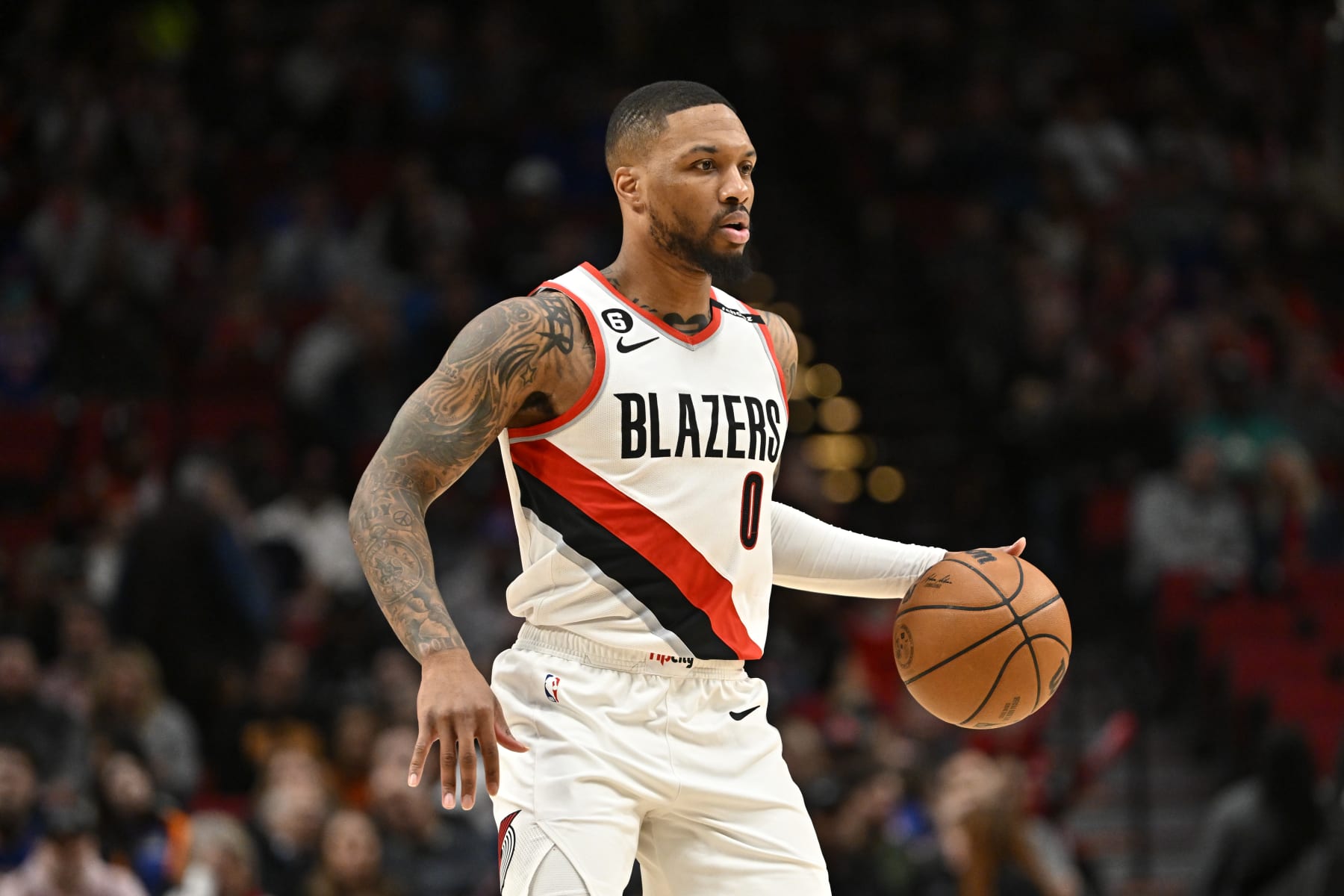 PORTLAND, OREGON - MARCH 14: Damian Lillard #0 of the Portland Trail Blazers dribbles during the first quarter against the New York Knicks at Moda Center on March 14, 2023 in Portland, Oregon. The New York Knicks won 123-107. NOTE TO USER: User expressly acknowledges and agrees that, by downloading and or using this photograph, User is consenting to the terms and conditions of the Getty Images License Agreement. (Photo by Alika Jenner/Getty Images)
