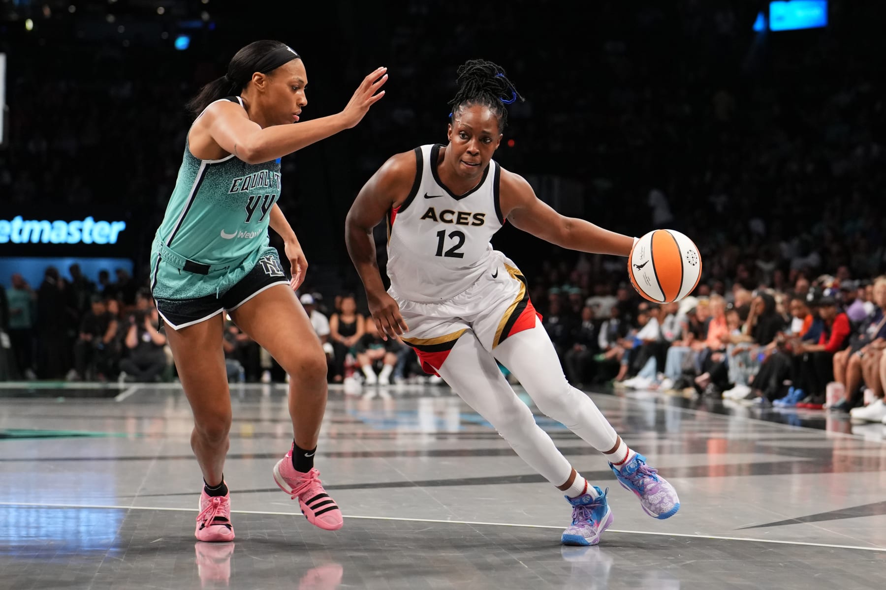 BROOKLYN, NY - AUGUST 28: Chelsea Gray #12 of the Las Vegas Aces dribbles the ball during the game against the New York Liberty on August 28, 2023 in Brooklyn, New York. NOTE TO USER: User expressly acknowledges and agrees that, by downloading and or using this photograph, user is consenting to the terms and conditions of the Getty Images License Agreement. Mandatory Copyright Notice: Copyright 2023 NBAE (Photo by Evan Yu/NBAE via Getty Images)