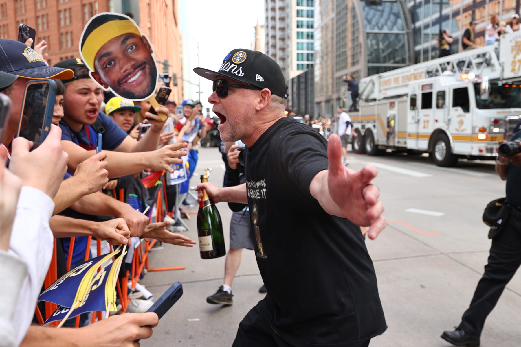 DENVER, CO - JUNE 15: Head Coach Michael Malone of the Denver Nuggets celebrates during the 2023 Denver Nuggets Championship Parade on June 15, 2023 in Denver, Colorado. NOTE TO USER: User expressly acknowledges and agrees that, by downloading and/or using this Photograph, user is consenting to the terms and conditions of the Getty Images License Agreement. Mandatory Copyright Notice: Copyright 2023 NBAE (Photo by Jamie Schwaberow/NBAE via Getty Images)