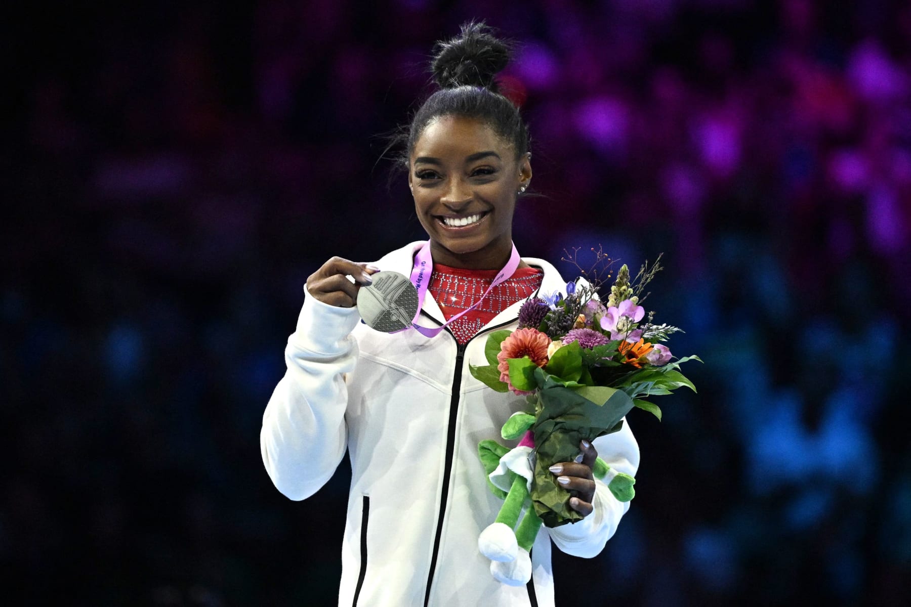 Second-placed US' Simone Biles celebrates on the podium after the Women's Vault Final during the 52nd FIG Artistic Gymnastics World Championships, in Antwerp, northern Belgium, on October 7, 2023. (Photo by Lionel BONAVENTURE / AFP) (Photo by LIONEL BONAVENTURE/AFP via Getty Images)