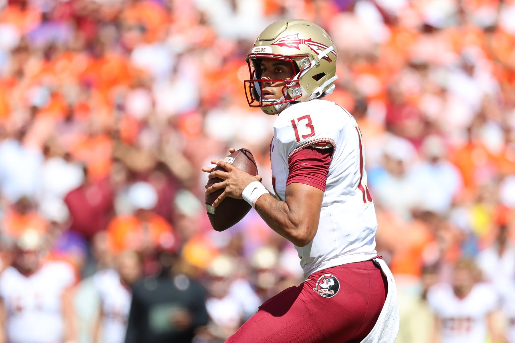CLEMSON, SOUTH CAROLINA - SEPTEMBER 23: Jordan Travis #13 of the Florida State Seminoles looks to pass the ball against the Clemson Tigers during the second quarter at Memorial Stadium on September 23, 2023 in Clemson, South Carolina. (Photo by Isaiah Vazquez/Getty Images)