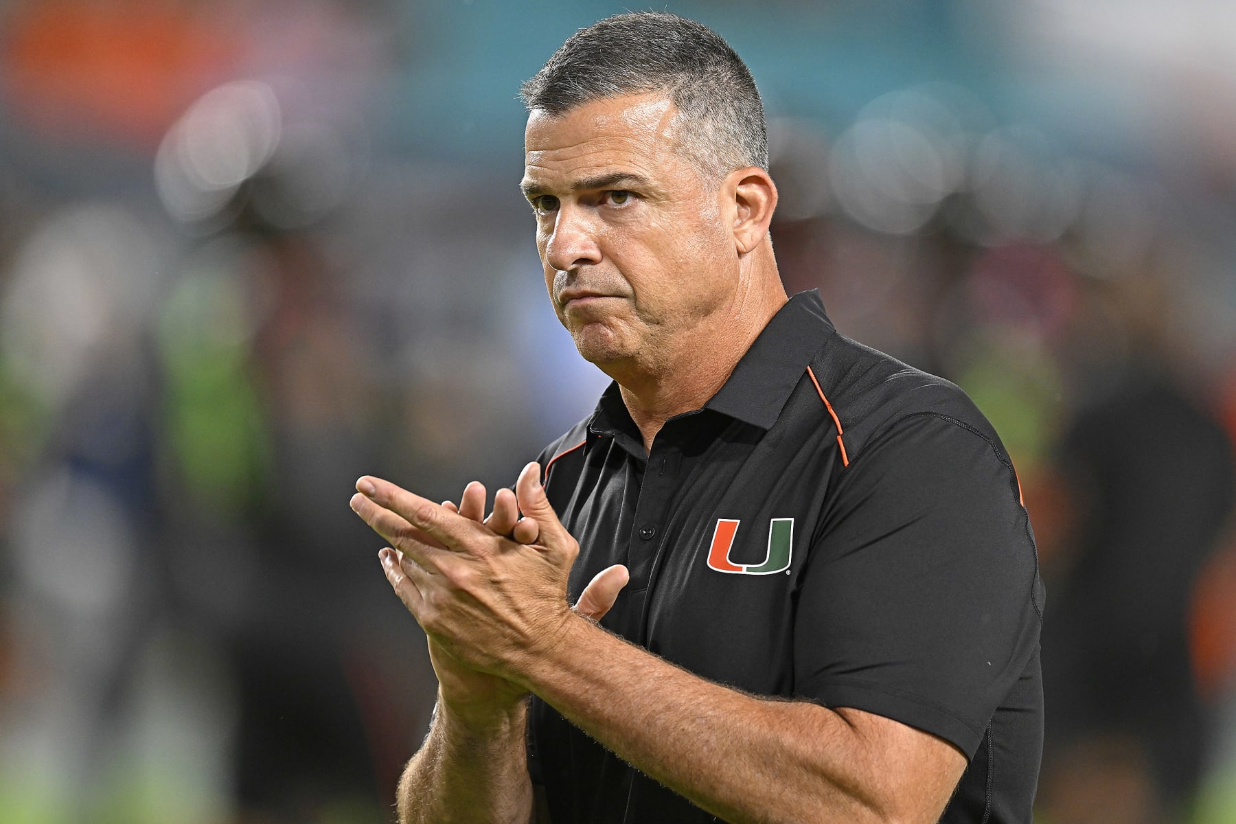 MIAMI GARDENS, FL - OCTOBER 07:  Miami head coach Mario Cristobal encourages his players as they warm up prior to the game as the Miami Hurricanes faced the Georgia Tech Yellow Jackets on October 7, 2023, at Hard Rock Stadium in Miami Gardens, Florida. (Photo by Samuel Lewis/Icon Sportswire via Getty Images)