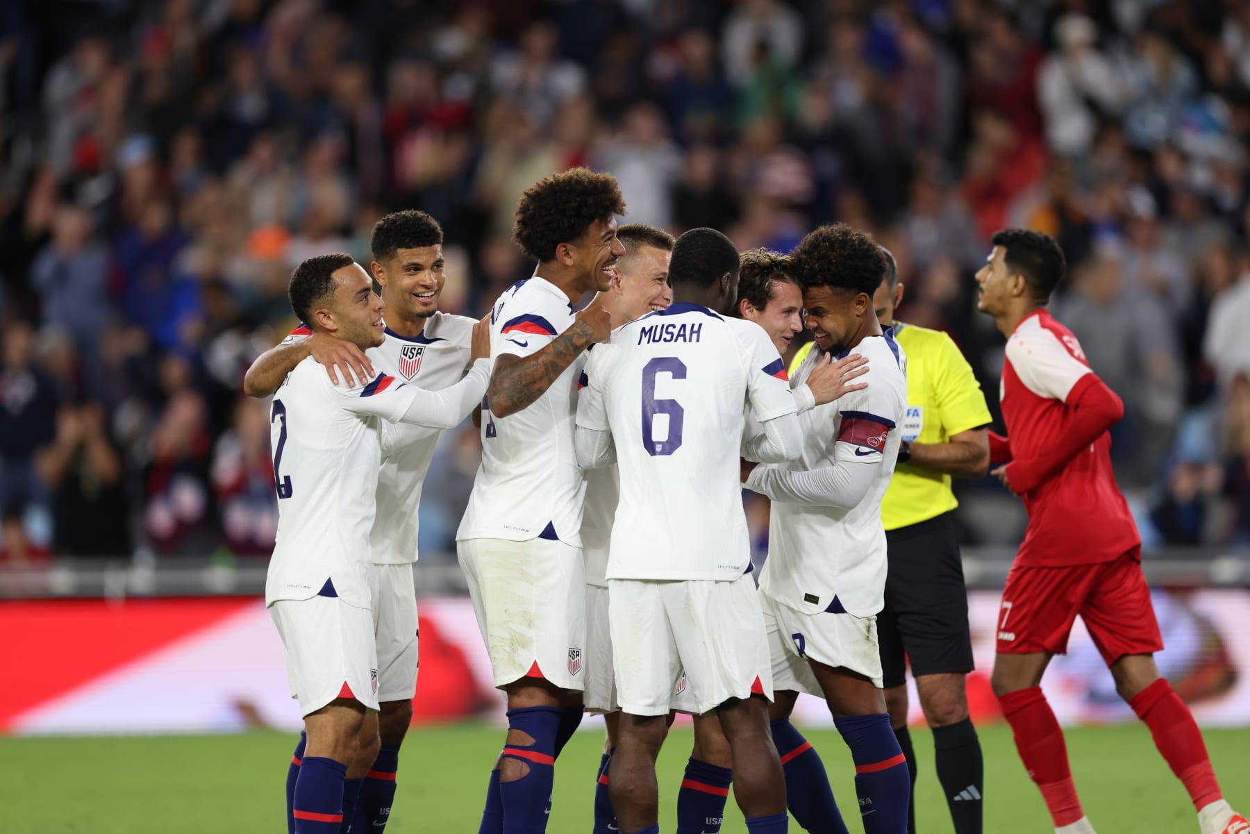 ST PAUL, MN - SEPTEMBER 12: Brenden Aaronson #11 of the United States celebrates scoring with teammates during an international friendly game between Oman and USMNT at Allianz Field on September 12, 2023 in St Paul, Minnesota. (Photo by John Dorton/ISI Photos/Getty Images).