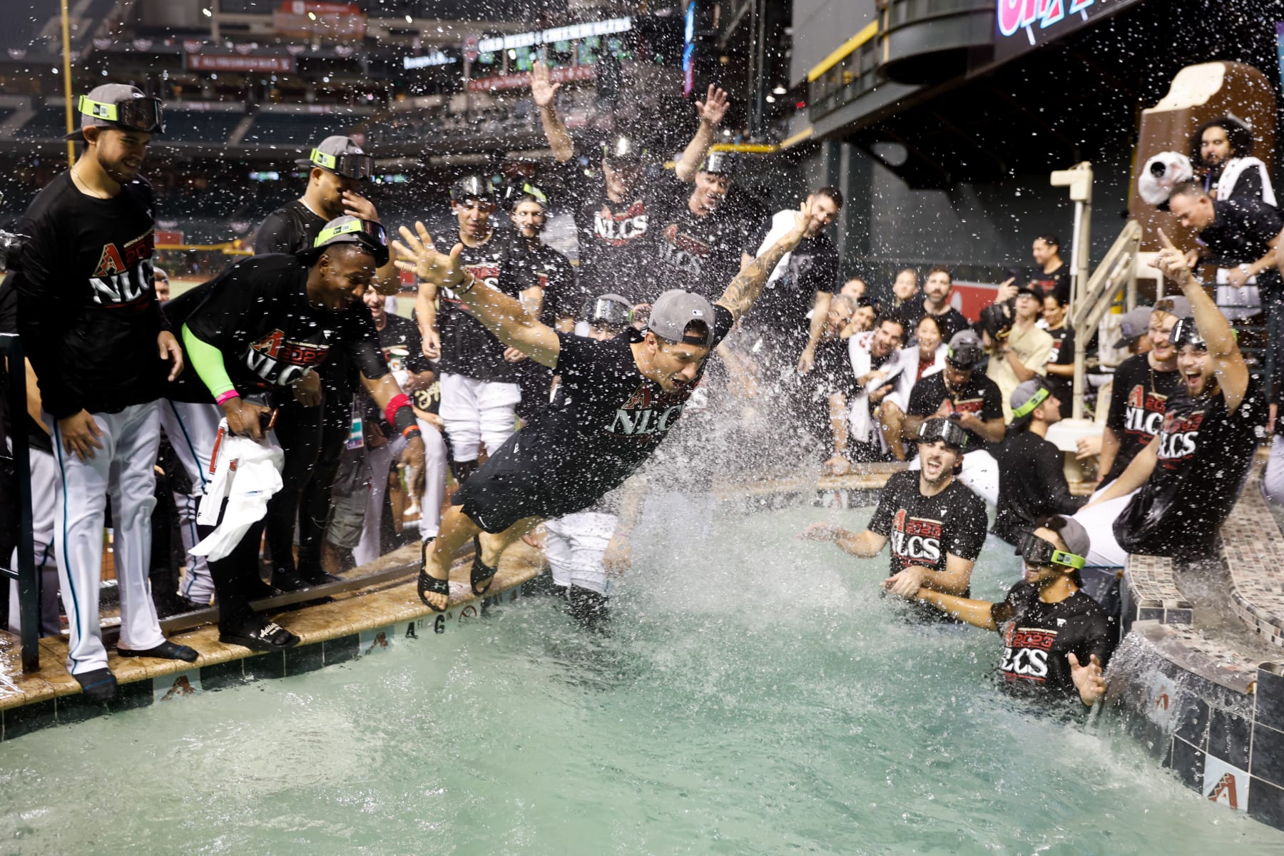 PHOENIX, AZ - OCTOBER 11: Members of the Arizona Diamondbacks celebrate after defeating the Los Angeles Dodgers in Game 3 of the Division Series at Chase Field on Wednesday, October 11, 2023 in Phoenix, Arizona. The Diamondbacks defeated the Dodgers 4-2 to advance to the National League Championship Series. (Photo by Chris Coduto/MLB Photos via Getty Images)