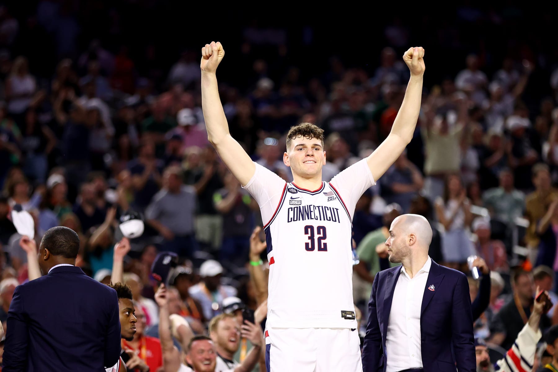 HOUSTON, TEXAS - APRIL 01: Donovan Clingan #32 of the Connecticut Huskies celebrates after defeating the Miami (Fl) Hurricanes during the NCAA Men’s Basketball Tournament Final Four semifinal game at NRG Stadium on April 01, 2023 in Houston, Texas. (Photo by Jamie Schwaberow/NCAA Photos via Getty Images)