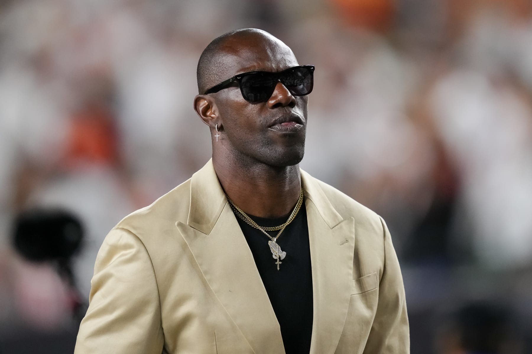 CINCINNATI, OHIO - SEPTEMBER 25: Former NFL player and Hall of Famer Terrell Owens walks across the field at halftime of the game between the Los Angeles Rams and the Cincinnati Bengals at Paycor Stadium on September 25, 2023 in Cincinnati, Ohio. (Photo by Dylan Buell/Getty Images)