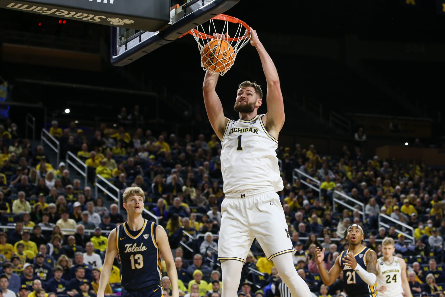 ANN ARBOR, MI - MARCH 14: Michigan Wolverines center Hunter Dickinson (1) dunks the ball during the first half a first round college basketball game of the National Invitational Tournament between the Toledo Rockets and the Michigan Wolverines on March 14, 2023 at the Crisler Center in Ann Arbor, Michigan. (Photo by Scott W. Grau/Icon Sportswire via Getty Images)
