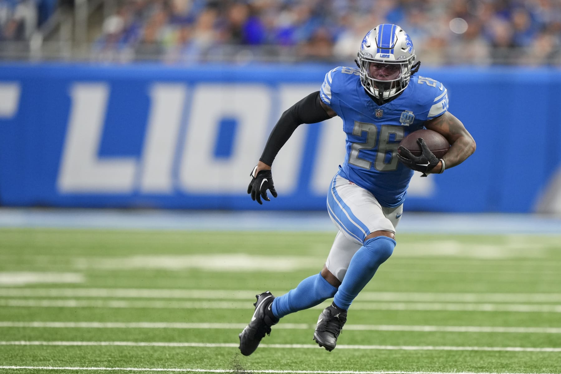 DETROIT, MI - SEPTEMBER 17: Running back Jahmyr Gibbs #26 of the Detroit Lions runs the ball during the first half of an NFL football game against the Seattle Seahawks at Ford Field on September 17, 2023 in Detroit, Michigan. (Photo by Todd Rosenberg/Getty Images)