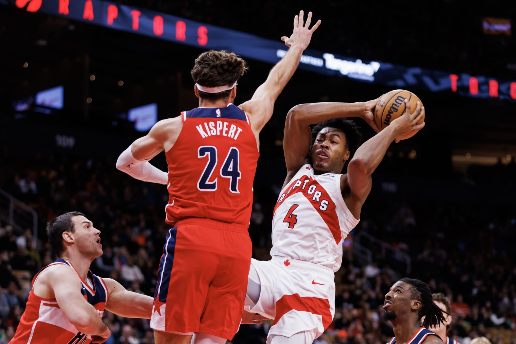 TORONTO, CANADA - OCTOBER 20: Scottie Barnes #4 of the Toronto Raptors drives to the net against Corey Kispert #24 of the Washington Wizards during the first half of their NBA game at Scotiabank Arena on October 20, 2023 in Toronto, Canada. NOTE TO USER: User expressly acknowledges and agrees that, by downloading and or using this photograph, User is consenting to the terms and conditions of the Getty Images License Agreement. (Photo by Cole Burston/Getty Images)