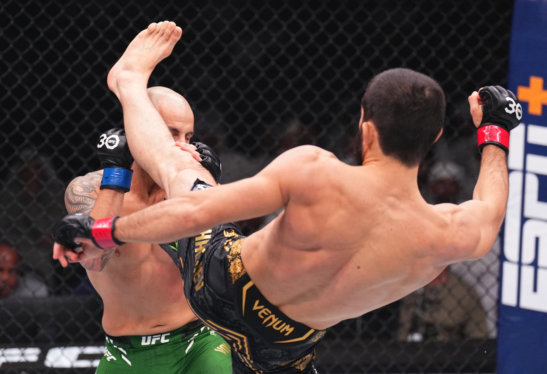 ABU DHABI, UNITED ARAB EMIRATES - OCTOBER 21: (R-L) Islam Makhachev of Russia kicks Alexander Volkanovski of Australia in the UFC lightweight championship fight during the UFC 294 event at Etihad Arena on October 21, 2023 in Abu Dhabi, United Arab Emirates. (Photo by Chris Unger/Zuffa LLC via Getty Images)