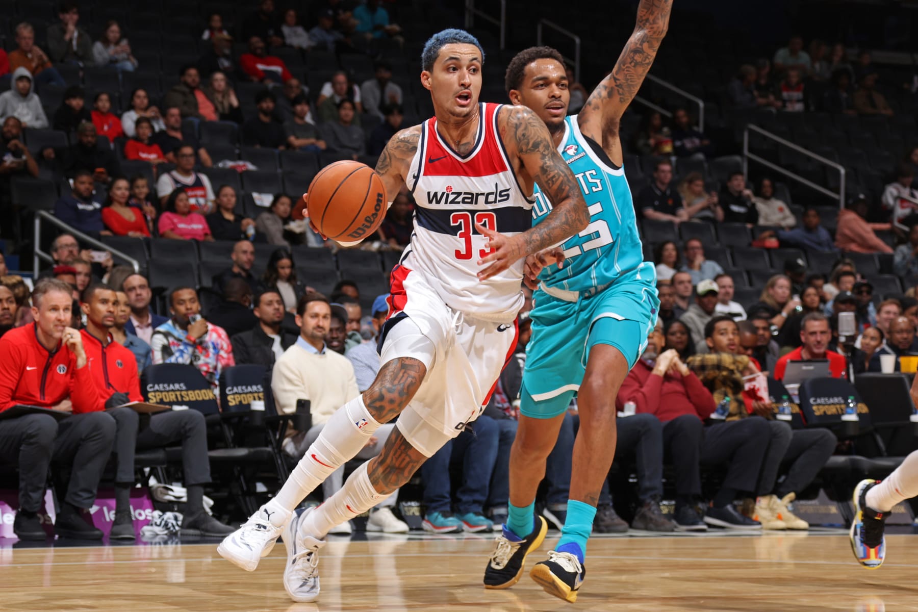 WASHINGTON, DC -  OCTOBER 12: Kyle Kuzma #33 of the Washington Wizards drives to the basket during the game against the Charlotte Hornets  on October 12, 2023 at Capital One Arena in Washington, DC. NOTE TO USER: User expressly acknowledges and agrees that, by downloading and or using this Photograph, user is consenting to the terms and conditions of the Getty Images License Agreement. Mandatory Copyright Notice: Copyright 2023 NBAE (Photo by Stephen Gosling/NBAE via Getty Images)