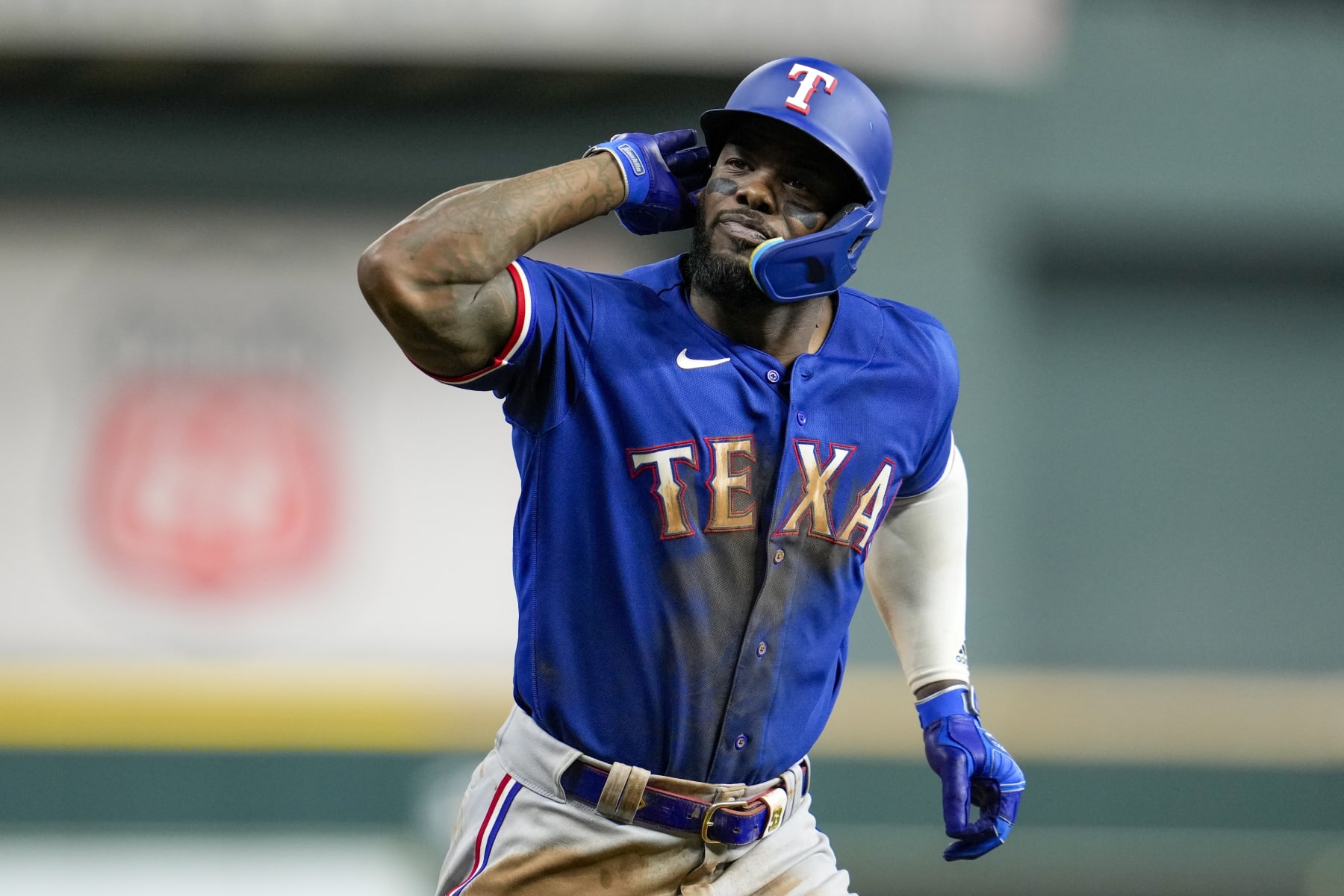 Texas Rangers' Adolis Garcia reacts after hitting a home run during the eighth inning of Game 6 of the baseball AL Championship Series against the Houston Astros Monday, Oct. 23, 2023, in Houston. (AP Photo/Godofredo A. Vásquez)