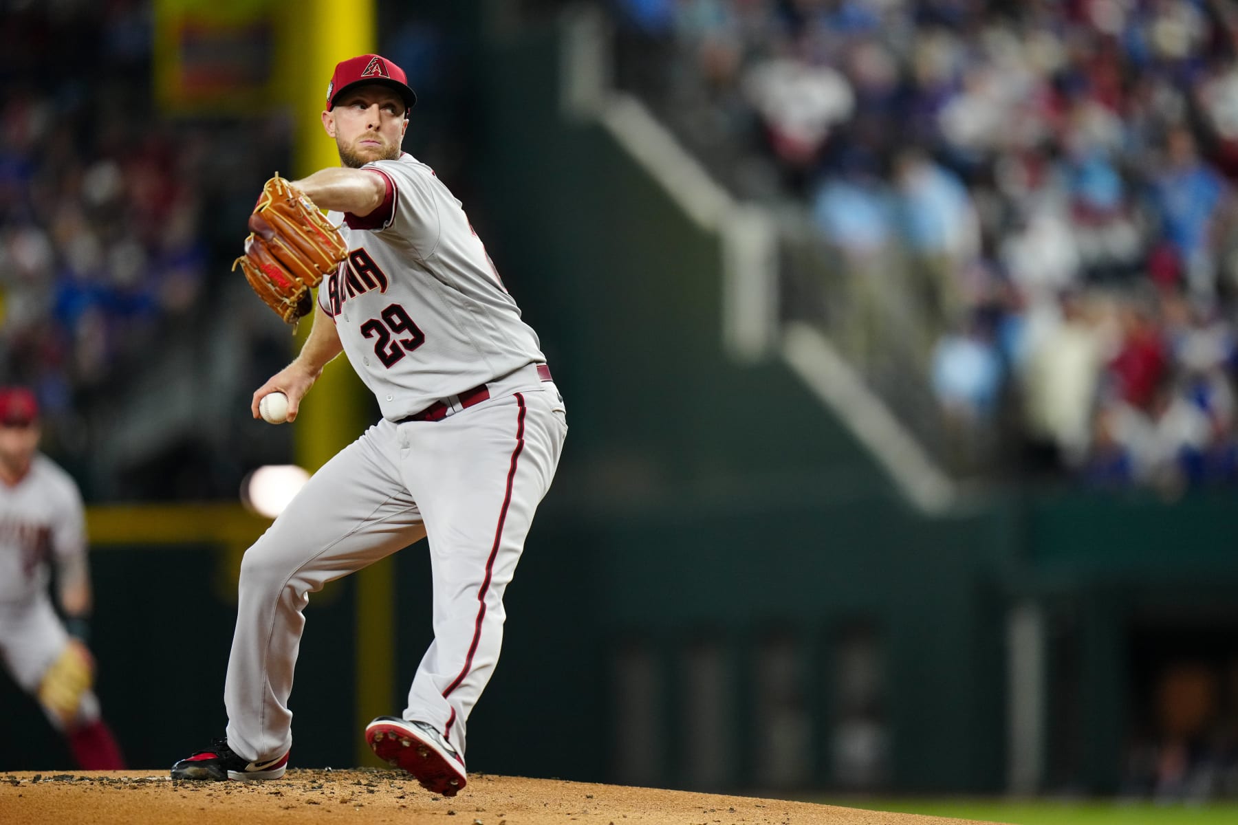 ARLINGTON, TX - OCTOBER 28: Merrill Kelly #29 of the Arizona Diamondbacks pitches during Game 2 of the 2023 World Series between the Arizona Diamondbacks and the Texas Rangers at Globe Life Field on Saturday, October 28, 2023 in Arlington, Texas. (Photo by Daniel Shirey/MLB Photos via Getty Images)