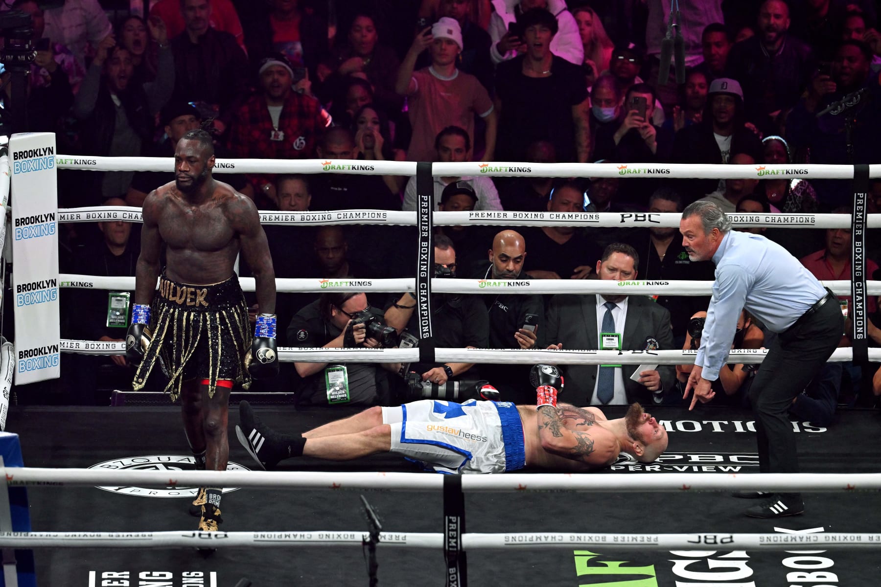 US boxer Deontay Wilder (R) knocks out Swedish-Finnish boxer Robert Helenius in the 1st round of their 12-round WBC World Heavyweight Title Eliminator fight at Barclays Center in Brooklyn, New York, on October 15, 2022. (Photo by ANGELA WEISS / AFP) (Photo by ANGELA WEISS/AFP via Getty Images)