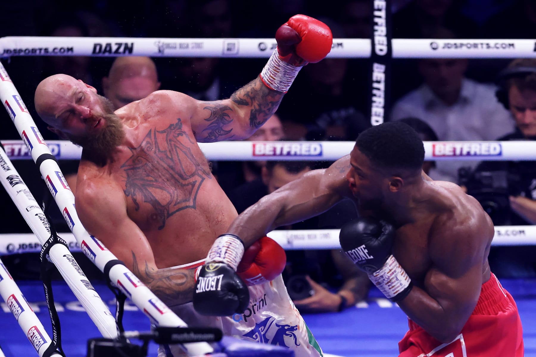LONDON, ENGLAND - AUGUST 12: Anthony Joshua knocks out Robert Helenius during the Heavyweight fight between Anthony Joshua and Robert Helenius at The O2 Arena on August 12, 2023 in London, England. (Photo by Julian Finney/Getty Images)