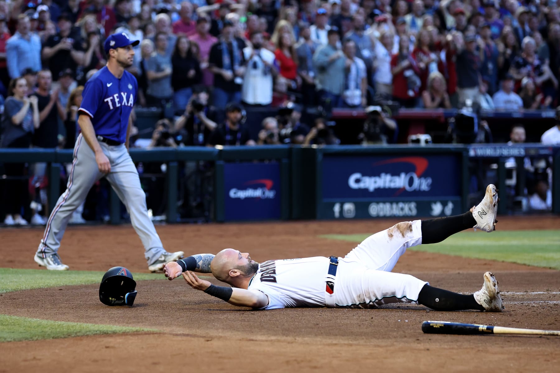 PHOENIX, ARIZONA - OCTOBER 30: Christian Walker #53 of the Arizona Diamondbacks reacts after being tagged out at home plate in the second inning against the Texas Rangers during Game Three of the World Series at Chase Field on October 30, 2023 in Phoenix, Arizona. (Photo by Christian Petersen/Getty Images)