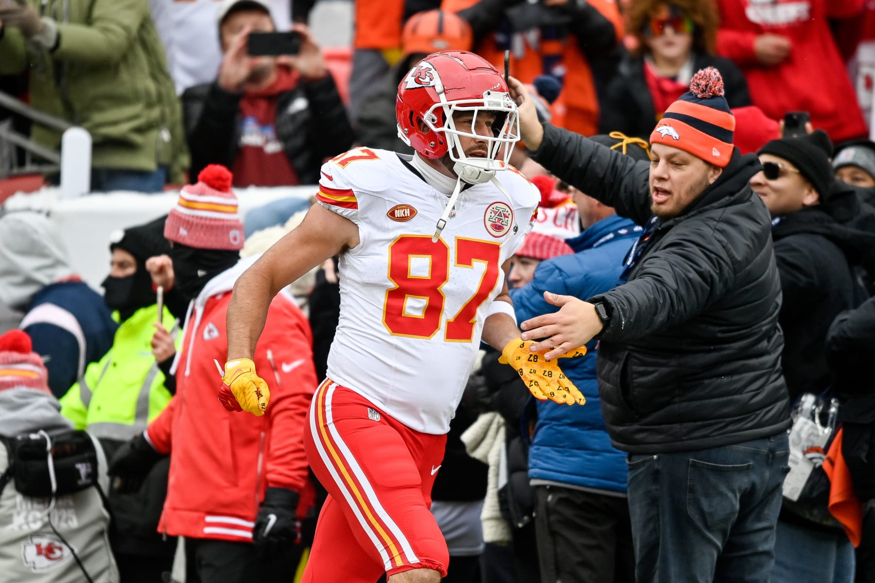 DENVER, CO - OCTOBER 29: Kansas City Chiefs tight end Travis Kelce (87) runs onto the field before warming up before a game between the Kansas City Chiefs and the Denver Broncos at Empower Field at Mile High on October 29, 2023 in Denver, Colorado. (Photo by Dustin Bradford/Icon Sportswire via Getty Images)