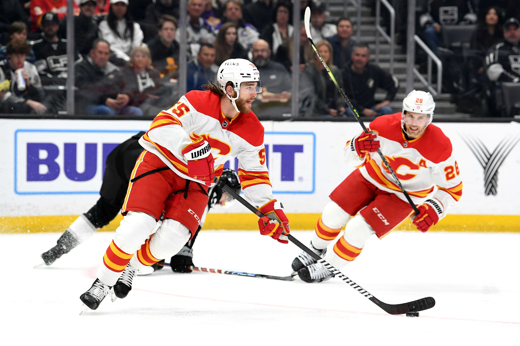 Calgary Flames defenseman Noah Hanifin (left) and center Elias Lindholm.