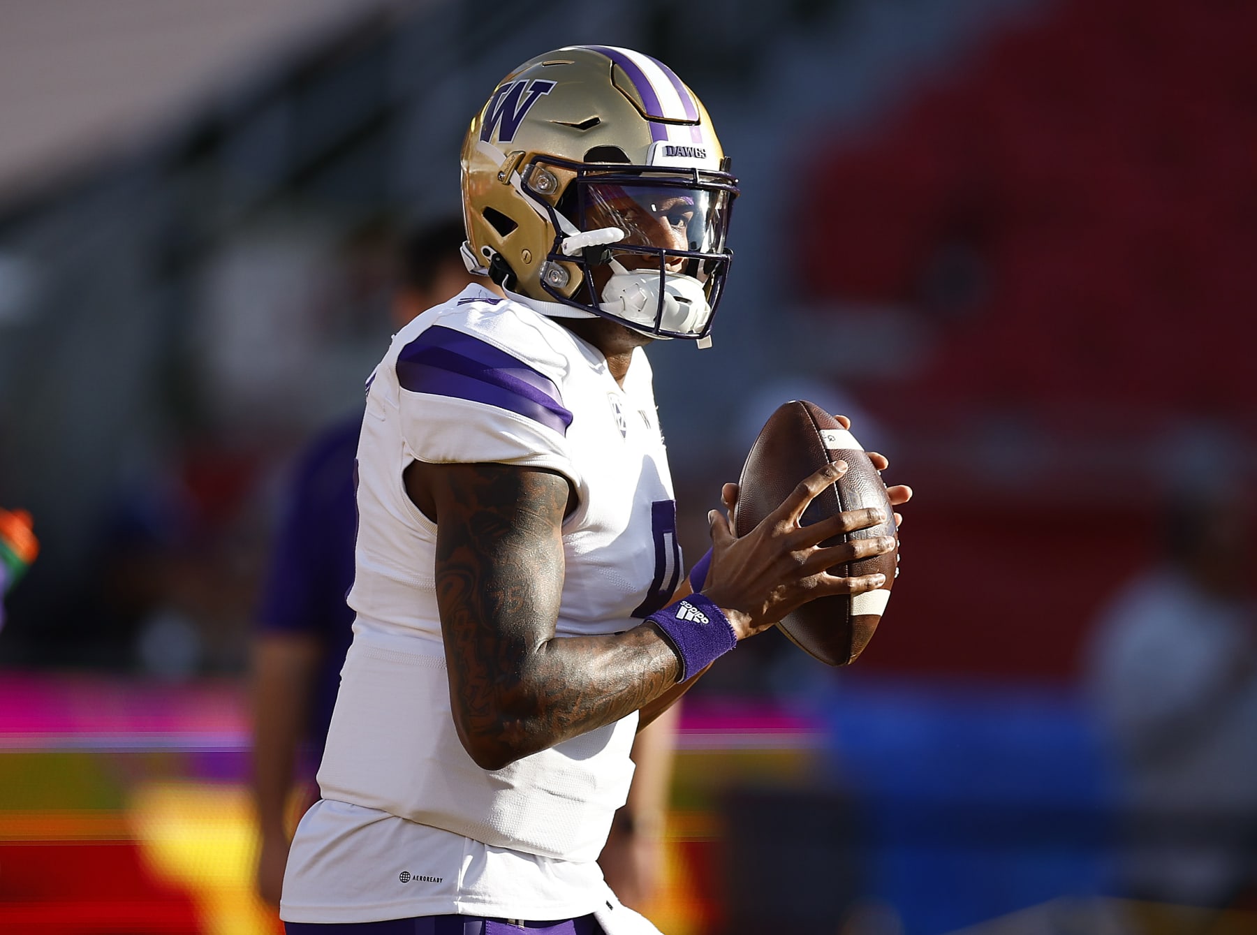 LOS ANGELES, CALIFORNIA - NOVEMBER 04: Michael Penix Jr. #9 of the Washington Huskies throws the football before the game against the USC Trojans at United Airlines Field at the Los Angeles Memorial Coliseum on November 04, 2023 in Los Angeles, California. (Photo by Ronald Martinez/Getty Images)