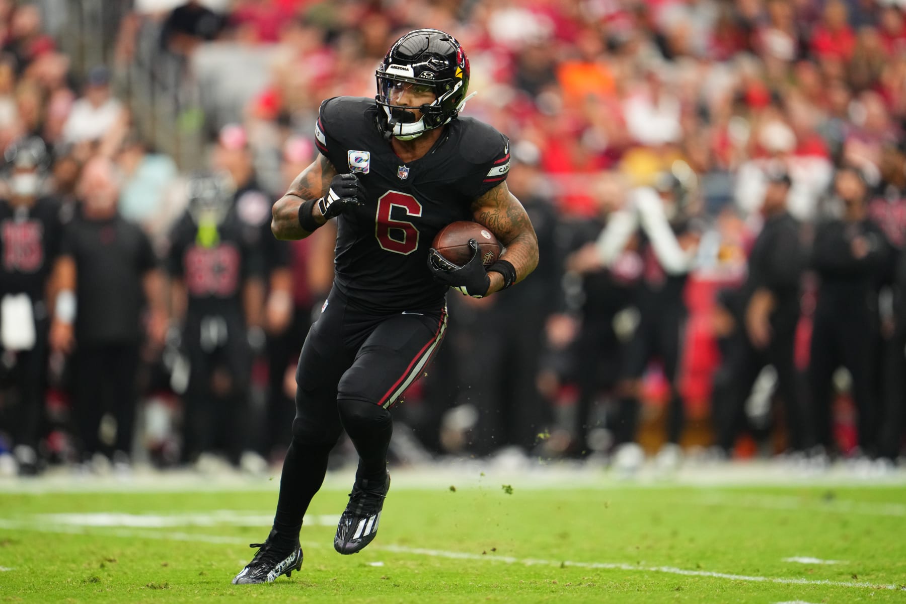 GLENDALE, AZ - OCTOBER 08: James Conner #6 of the Arizona Cardinals carries the ball against the Cincinnati Bengals during the first half at State Farm Stadium on October 8, 2023 in Glendale, Arizona. (Photo by Cooper Neill/Getty Images)