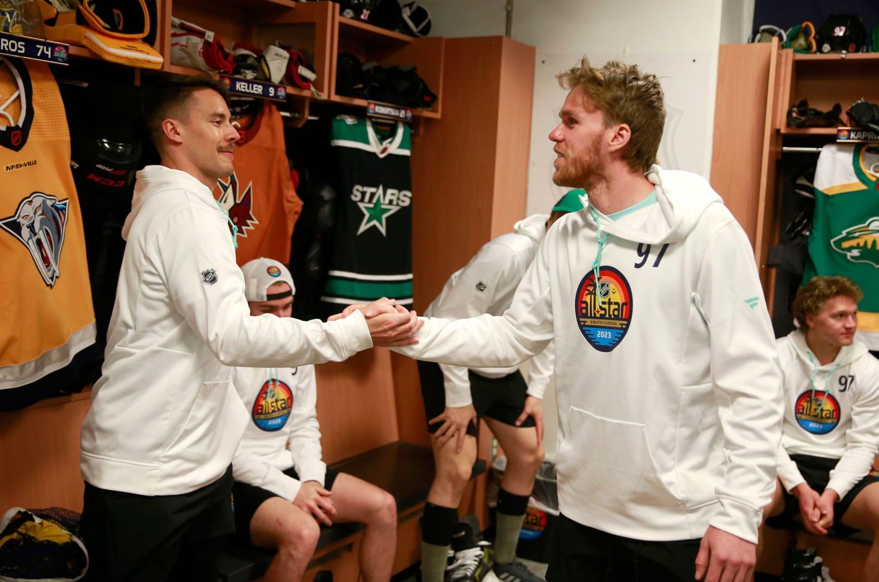 SUNRISE, FLORIDA - FEBRUARY 03: (L-R) Juuse Saros #74 of the Nashville Predators and Connor McDavid #97 of the Edmonton Oilers shake hands in the locker room before the skills competition at FLA Live Arena on February 03, 2023 in Sunrise, Florida. (Photo by Jeff Vinnick/NHLI via Getty Images)