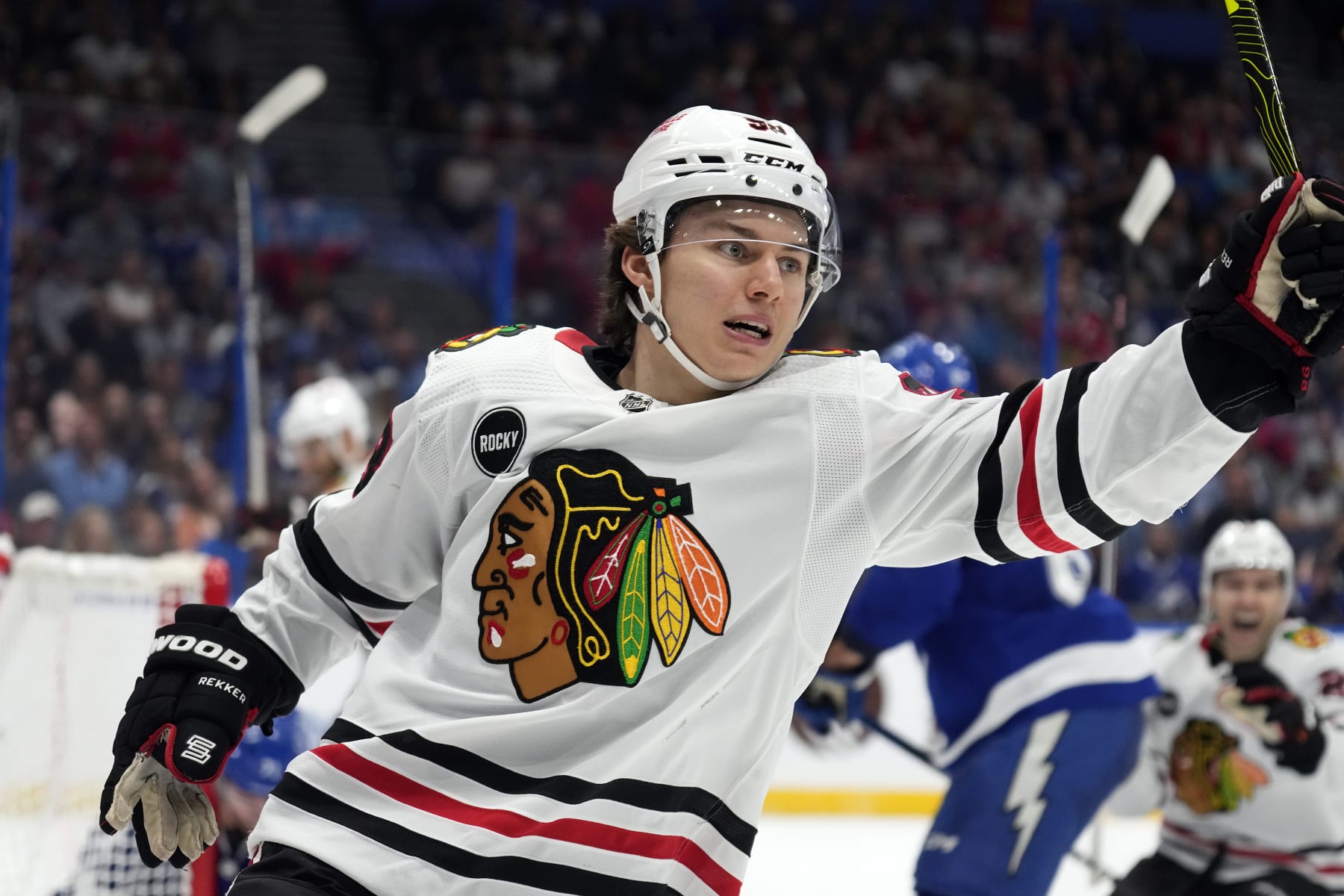 Chicago Blackhawks center Connor Bedard (98) celebrates after scoring against the Tampa Bay Lightning during the first period of an NHL hockey game Thursday, Nov. 9, 2023, in Tampa, Fla. (AP Photo/Chris O'Meara)